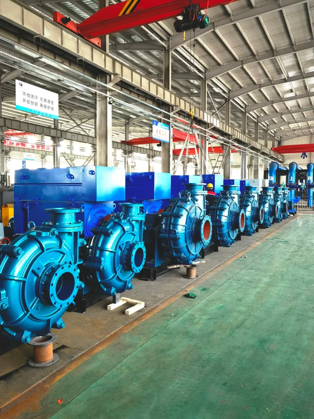 Row of SZP-series pump sets under the workshop crane